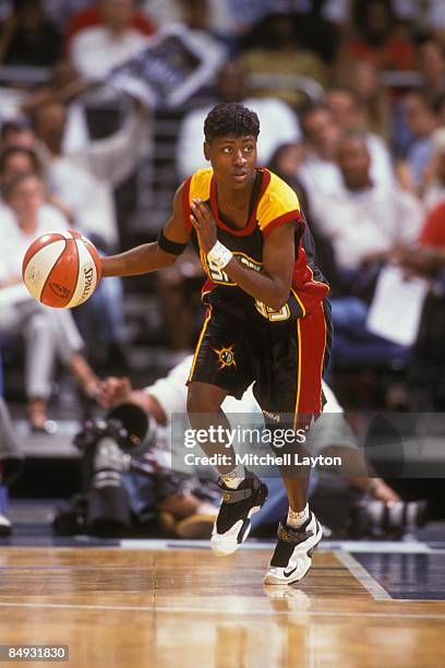 Tamika Jackson of the Detroit Shock dribbles up court during a WNBA basketball game against the Washington Mystics on August 1, 2001 at Verizon...