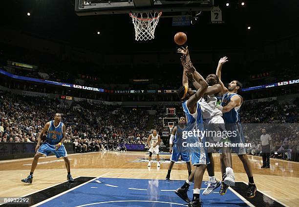 Al Jefferson of the Minnesota Timberwolves shoots against Melvin Ely and Peja Stojakovic of the New Orleans Hornets during the game on January 23,...