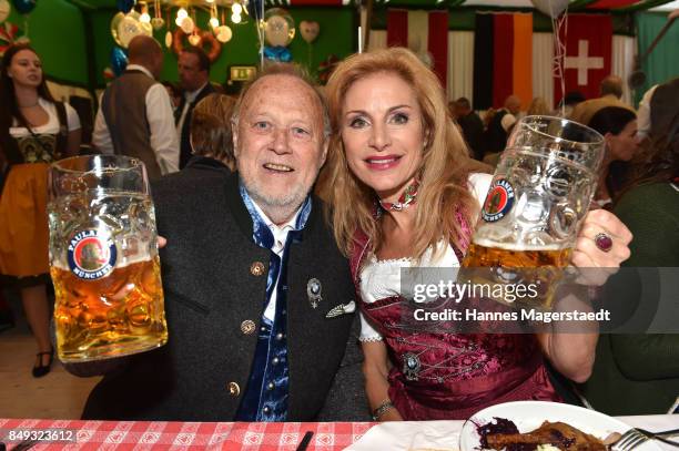 Joseph Vilsmaier and his partner Birgit Muth during the BMW Armbrustschiessen as part of the Oktoberfest 2017 at Armbrust-Schuetzenfesthalle on...