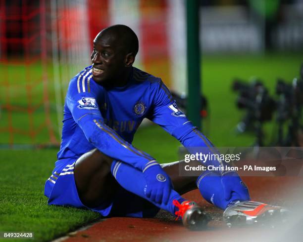 Chelsea's Demba Ba smiles as he sits behind the goal