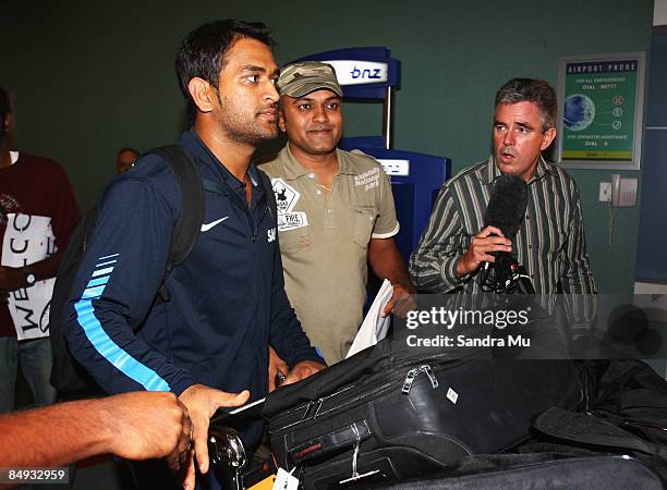 Dhoni of India walks through the arrivals hall as the Indian cricket team arrive at Auckland International Airport on February 20, 2009 in Auckland,...