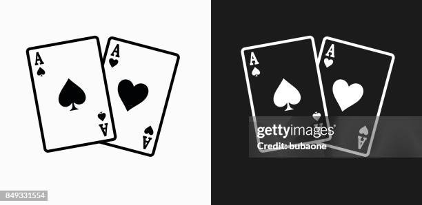 ace of spades and hearts icon on black and white vector backgrounds - gambling stock illustrations