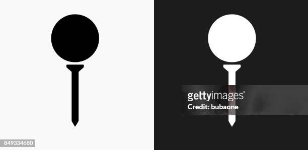 golf ball on tee icon on black and white vector backgrounds - golf tee stock illustrations