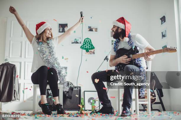 making a christmas song - woman in guitar making studio stock pictures, royalty-free photos & images