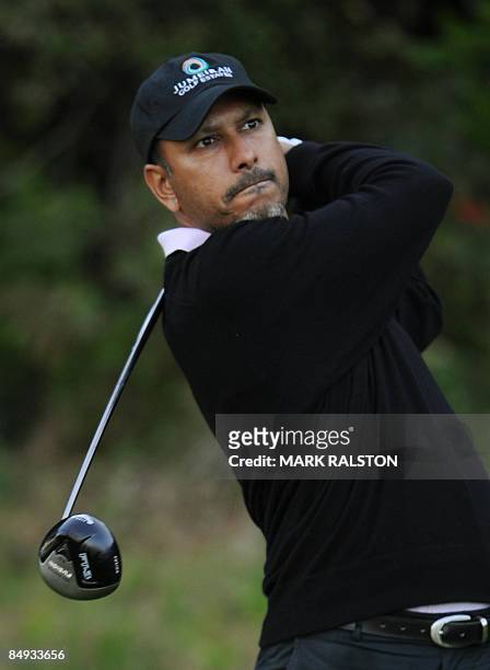 Jeev Singh of India watches his tee shot at the thirteenth hole on day one of the Northern Trust Open held at the Riviera Country Club in Los Angeles...