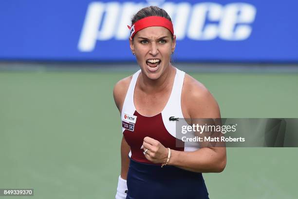 Dominika Cibulova of Slovakia celebrates winning her match against Carla Suarez Navarro of Spain during day two of the Toray Pan Pacific Open Tennis...