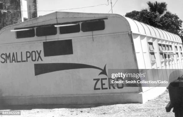 Image on the side of a medical clinic annex building reading Smallpox Zero, expressing the World Health Organization's goal of eradicating the...