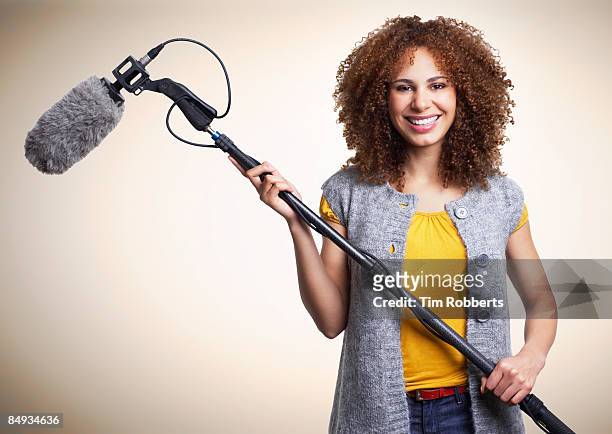 young woman with boom microphone - mikrofonhållare bildbanksfoton och bilder