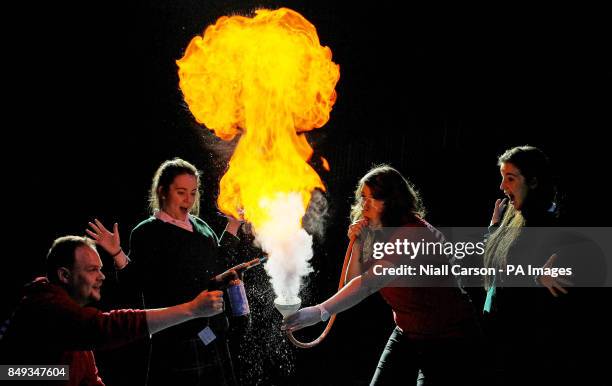 Naoise O'Driscoll and Saoirse O'Reilly from Loreto High School watch as Laura Meade and Ronan Bullar from the Science Museum in London set fire to...