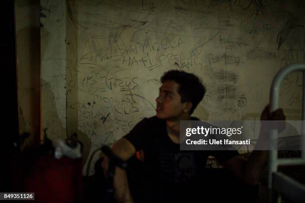 Graffiti of recovering drug addicts is seen on the wall of Nurul Ichsan Al Islami traditional rehabilitation centre on September 16, 2017 in...