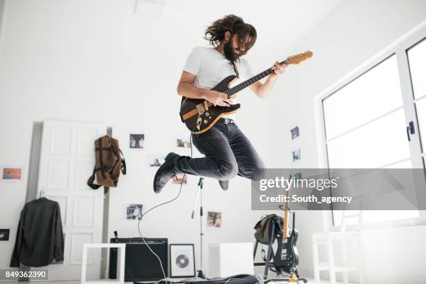 handsome guitarist - electric guitar stock pictures, royalty-free photos & images