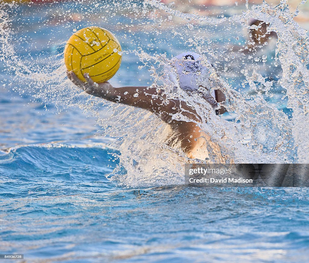Water polo player passing the ball.