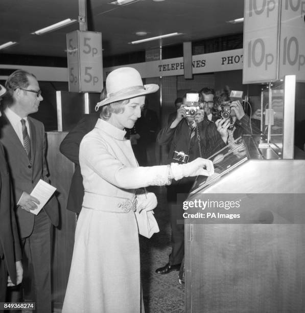 Princess Alexandra taking an Underground ticket from a machine at Brixton Station when she opened the Brixton extension of the Victoria Line today....