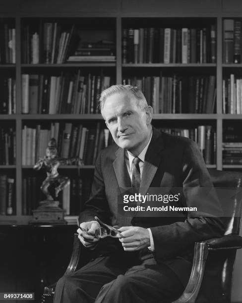 Portrait of American philanthropist John D Rockefeller III as he sits in a library, New York, New York, June 11, 1964.