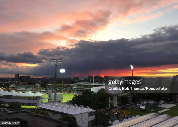 Test match cricket continues beneath a dramatic sky at Lord's cricket ground in London, which is floodlit as the sun sets in the west, with this...