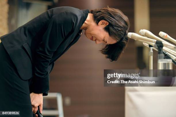 Lower house lawmaker Mayuko Toyota bows for apology during a press conference after the meeting with her supporters t her constituency on September...