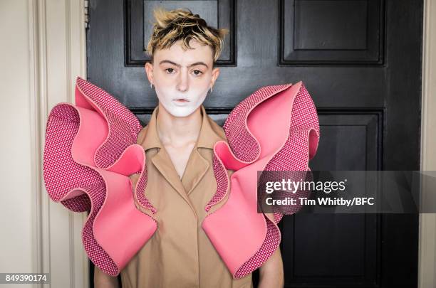 Model poses for a photo backstage ahead of the minki presentation during London Fashion Week September 2017 on September 19, 2017 in London, England.