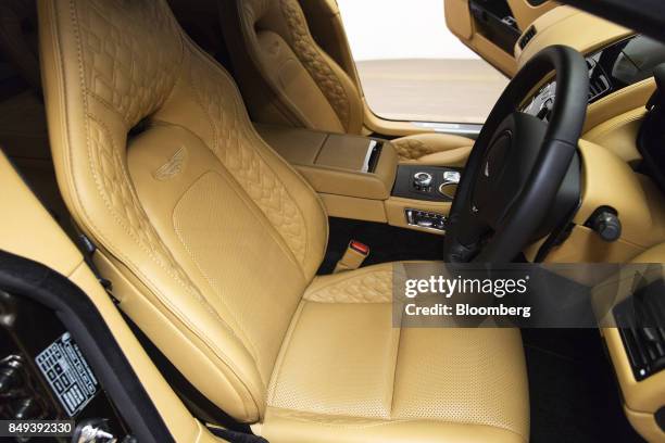 The interior of an Aston Martin Rapide S luxury automobile is seen at an Aston Martin Lagonda Ltd. Showroom in Singapore, on Tuesday, Sept. 19, 2017....