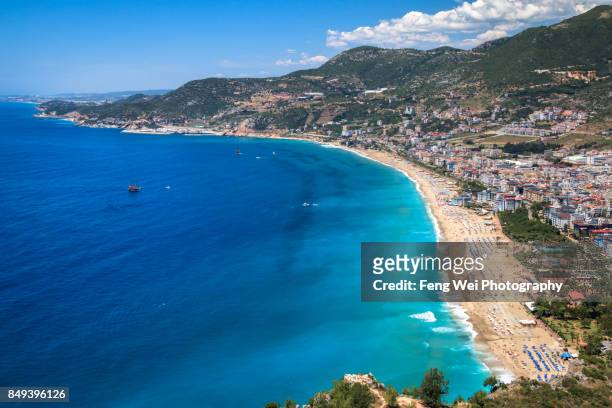 mediterranean coast, kleopatra beach, alanya, antalya, turkey - antalya stock pictures, royalty-free photos & images