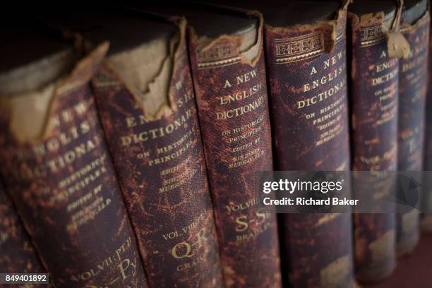 Antiquarian copies of The New English Dictionary on Historical Principles edited by Sir James Murray, line shelves in the Lee Library of the British...
