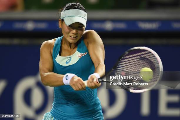 Risa Ozaki of Japan plays a backhand against Shelby Rogers of the USA during day two of the Toray Pan Pacific Open Tennis At Ariake Coliseum on...