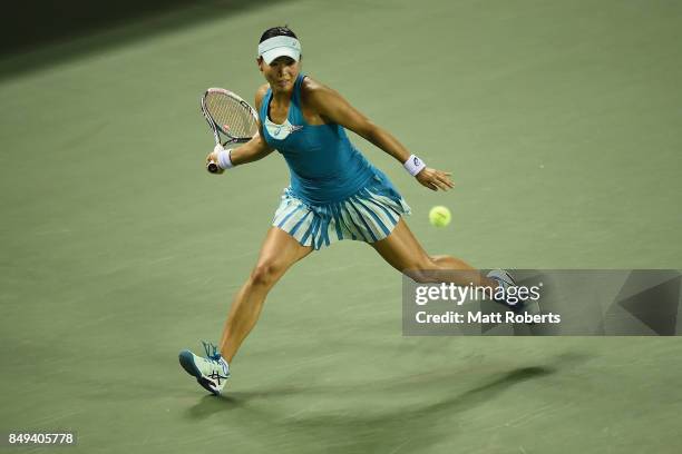 Risa Ozaki of Japan plays a forehand against Shelby Rogers of the USA during day two of the Toray Pan Pacific Open Tennis At Ariake Coliseum on...