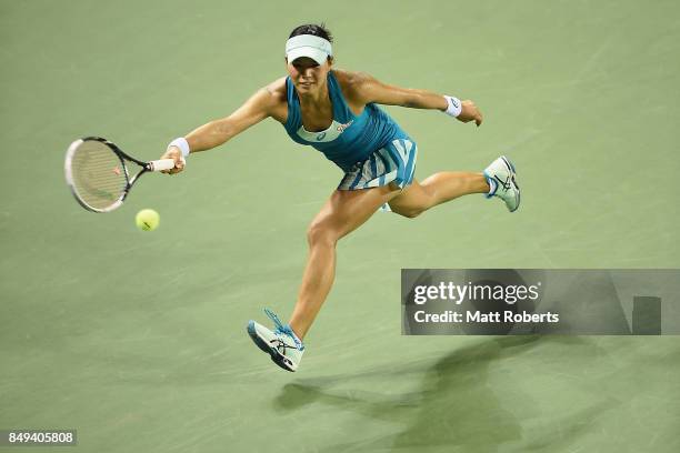 Risa Ozaki of Japan plays a forehand against Shelby Rogers of the USA during day two of the Toray Pan Pacific Open Tennis At Ariake Coliseum on...