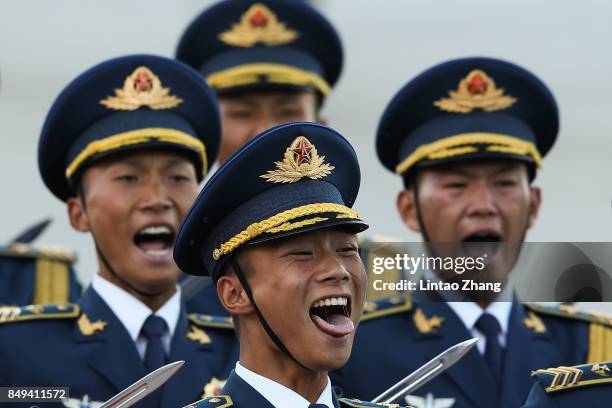 Honour guard troops march during a welcoming ceremony for Singapore Prime Minister, Lee Hsien Loong outside the Great Hall of the People on September...