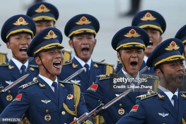 Honour guard troops march during a welcoming ceremony for Singapore Prime Minister, Lee Hsien Loong outside the Great Hall of the People on September...
