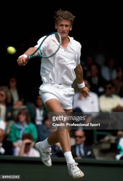 Patrik Kuhnen of West Germany in action during a men's singles match at the Wimbledon Lawn Tennis Championships in London, circa July 1988. The...