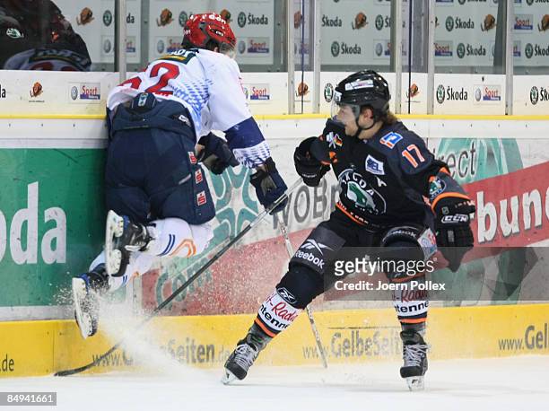 Sebastian Furchner of Wolfsburg and Philipp Schlager of Kassel in action during the DEL match between Grizzly Adams Wolfsburg and Kassel Huskies at...