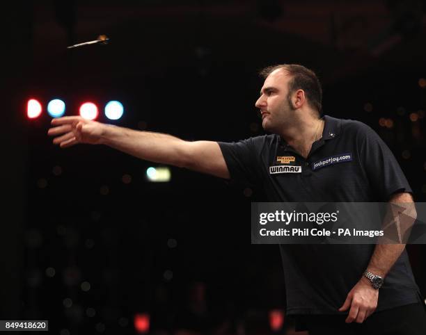 Scott Waites in action against Richie George during the BDO World Professional Darts Championships at the Lakeside Complex, Surrey.
