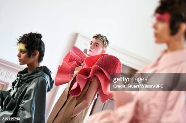 Models showcase designs at the minki presentation during London Fashion Week September 2017 on September 19, 2017 in London, England.