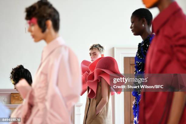 Models showcase designs at the minki presentation during London Fashion Week September 2017 on September 19, 2017 in London, England.