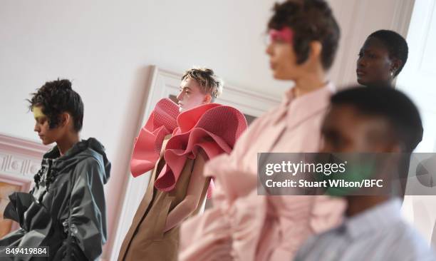 Models showcase designs at the minki presentation during London Fashion Week September 2017 on September 19, 2017 in London, England.