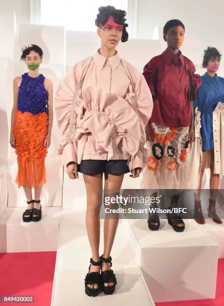 Models showcase designs at the minki presentation during London Fashion Week September 2017 on September 19, 2017 in London, England.