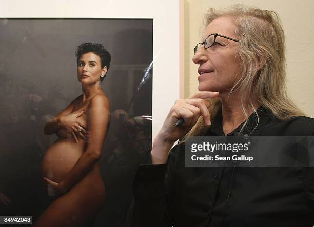Photographer Annie Leibovitz speaks to the media while standing in front of a portrait of pregnant actress Demi Moore during a walk-through of the...