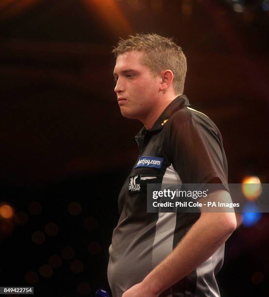 Richie George stands dejected during his match against Scott Waites during the BDO World Professional Darts Championships at the Lakeside Complex,...