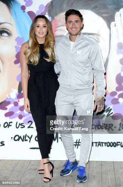 Stephen Bear and Charlotte Crosby attend a photocall for 'Just Tattoo Of Us: Can You Deal With The Reveal?' pop-up tattoo parlour on September 19,...