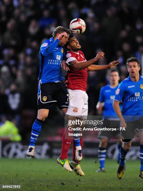 Leeds United's Paul Green and Barnsley's Jacob Mellis battle for the ball during the npower Football League Championship match at Oakwell Stadium,...