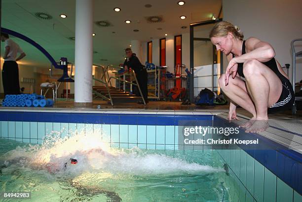 Certified sports scientist Katrin Maeussler watches a triathlete swimming during a sports performance diagnostic at the Medicos Auf Schalke...