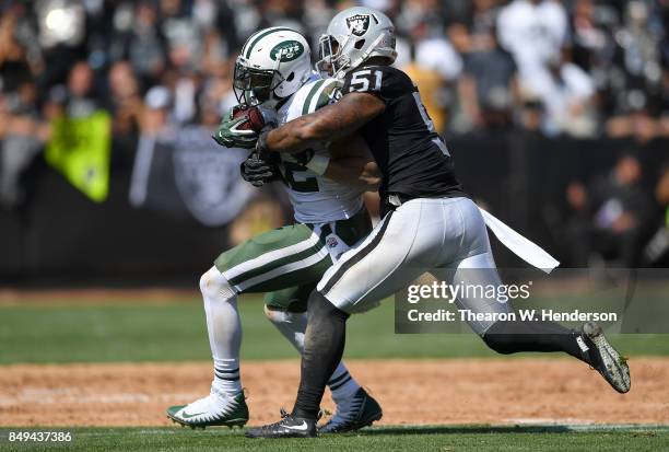 Bruce Irvin of the Oakland Raiders tackles Matt Forte of the New York Jets during the second quarter of their NFL football game at Oakland-Alameda...