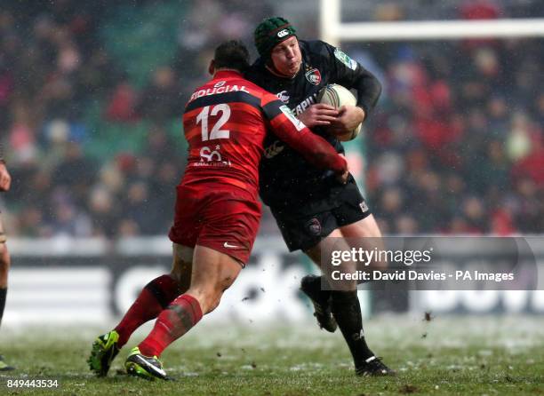 Leicester's Thomas Waldrom is tackled by Toulouse's Luke McAlister during the Heineken Cup, Pool Two match at Welford Road, Leicester.