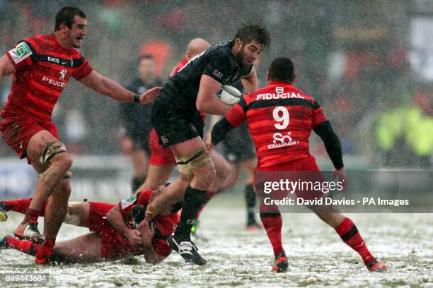 Leicester's Geoff Parling is tackled by Toulouse's Lionel Beauxis during the Heineken Cup, Pool Two match at Welford Road, Leicester.