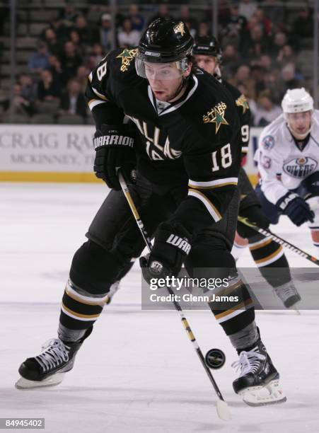 James Neal of the Dallas Stars tries to get control of a bouncing puck against the Edmonton Oilers on February 19, 2009 at the American Airlines...