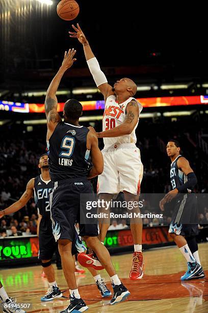 David West of the Western Conference puts a shot up over Rashard Lewis of the Eastern Conference during the 58th NBA All-Star Game, part of 2009 NBA...