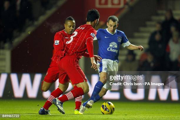 Southampton's Nathaniel Clyne battles for the ball with Everton's Leon Osman alongside teammate Maya Yoshida