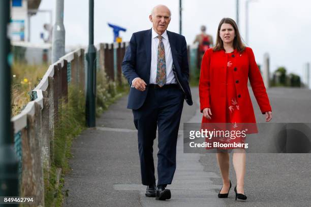 Vince Cable, leader of the U.K.'s Liberal Democrat Party, left, arrives with Jo Swinson, deputy leader of the Liberal Democrat Party, ahead of his...
