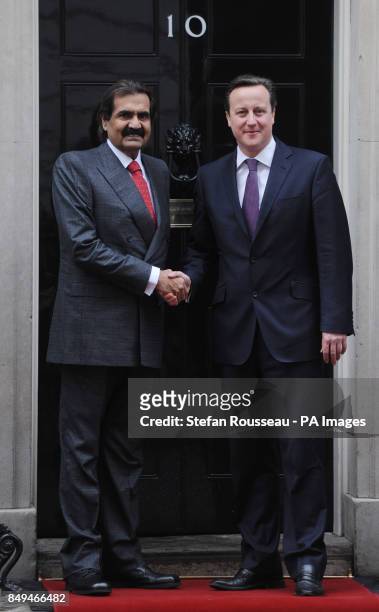 Prime Minister David Cameron greets the Emir of Qatar Sheikh Hamad bin Khalifa Al Thani at 10 Downing Street, London.