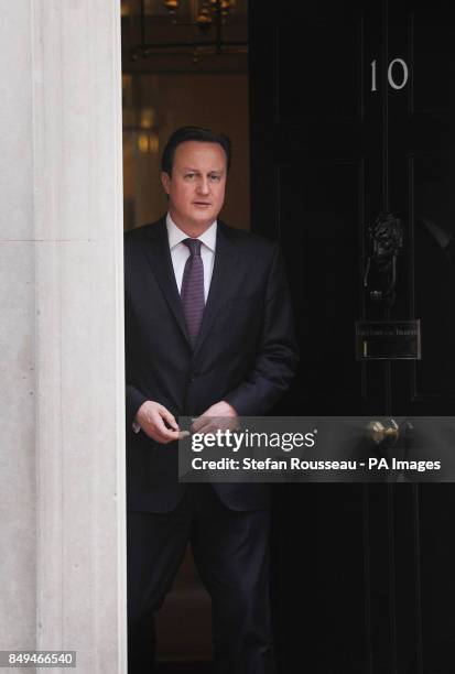 Prime Minister David Cameron prepares to greet the Emir of Qatar Sheikh Hamad bin Khalifa Al Thani at 10 Downing Street, London.